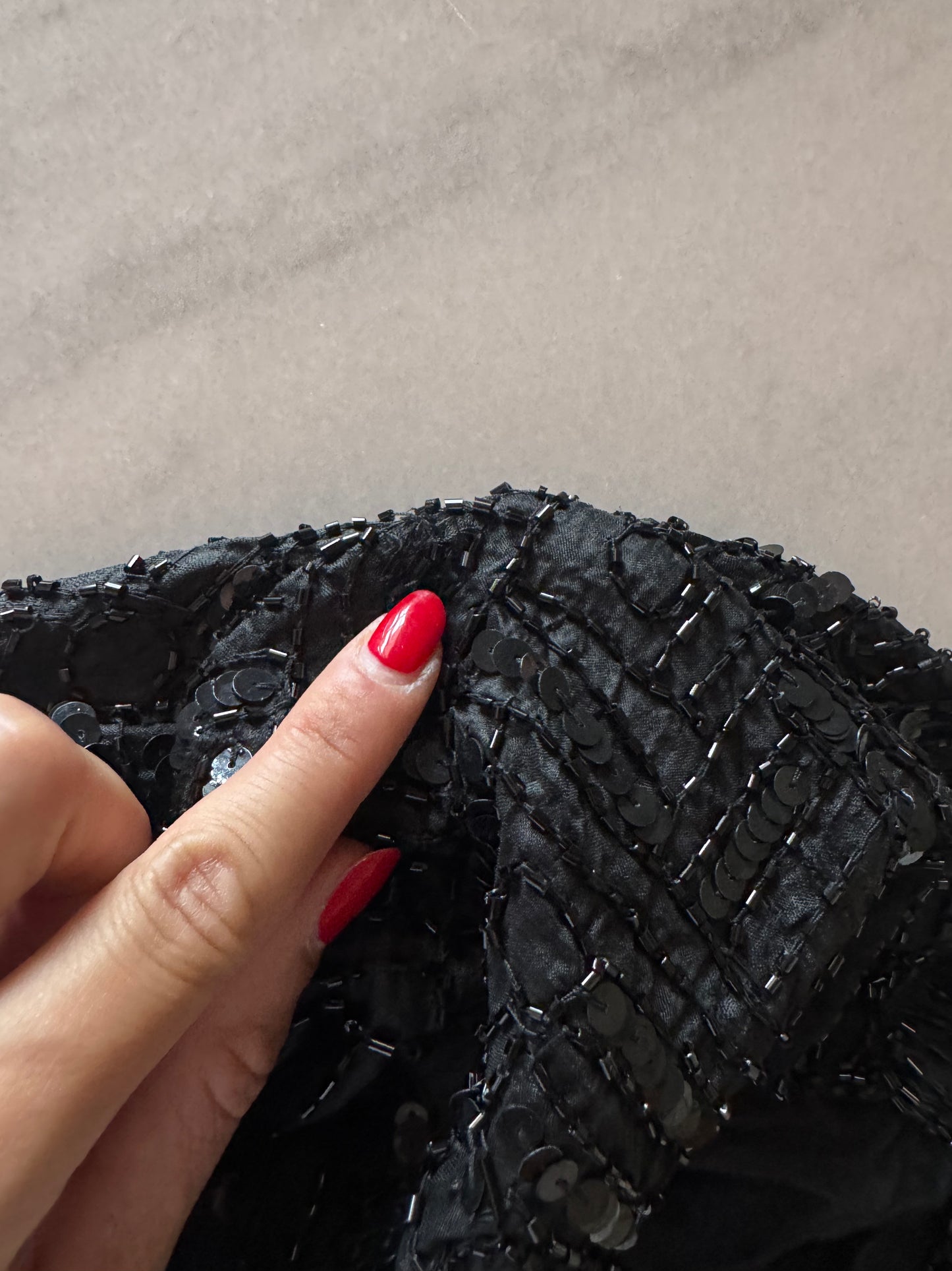 The black sequins vest