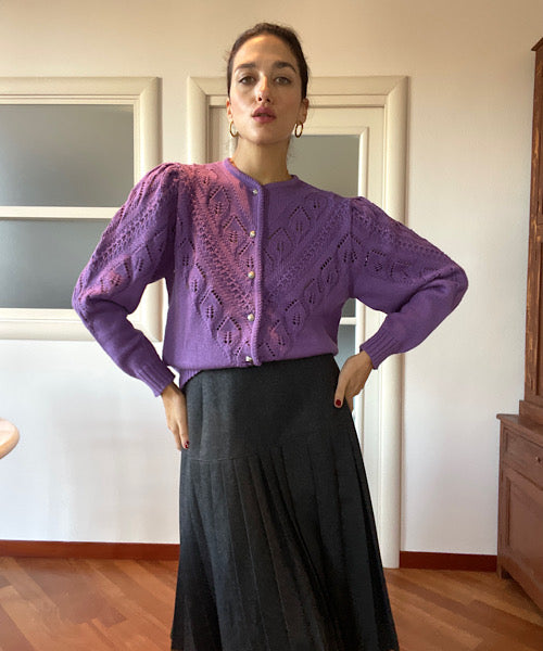 The dark grey pleated skirt