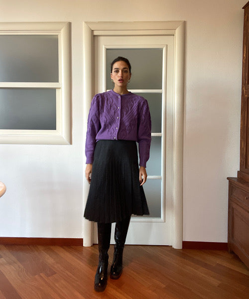 The dark grey pleated skirt