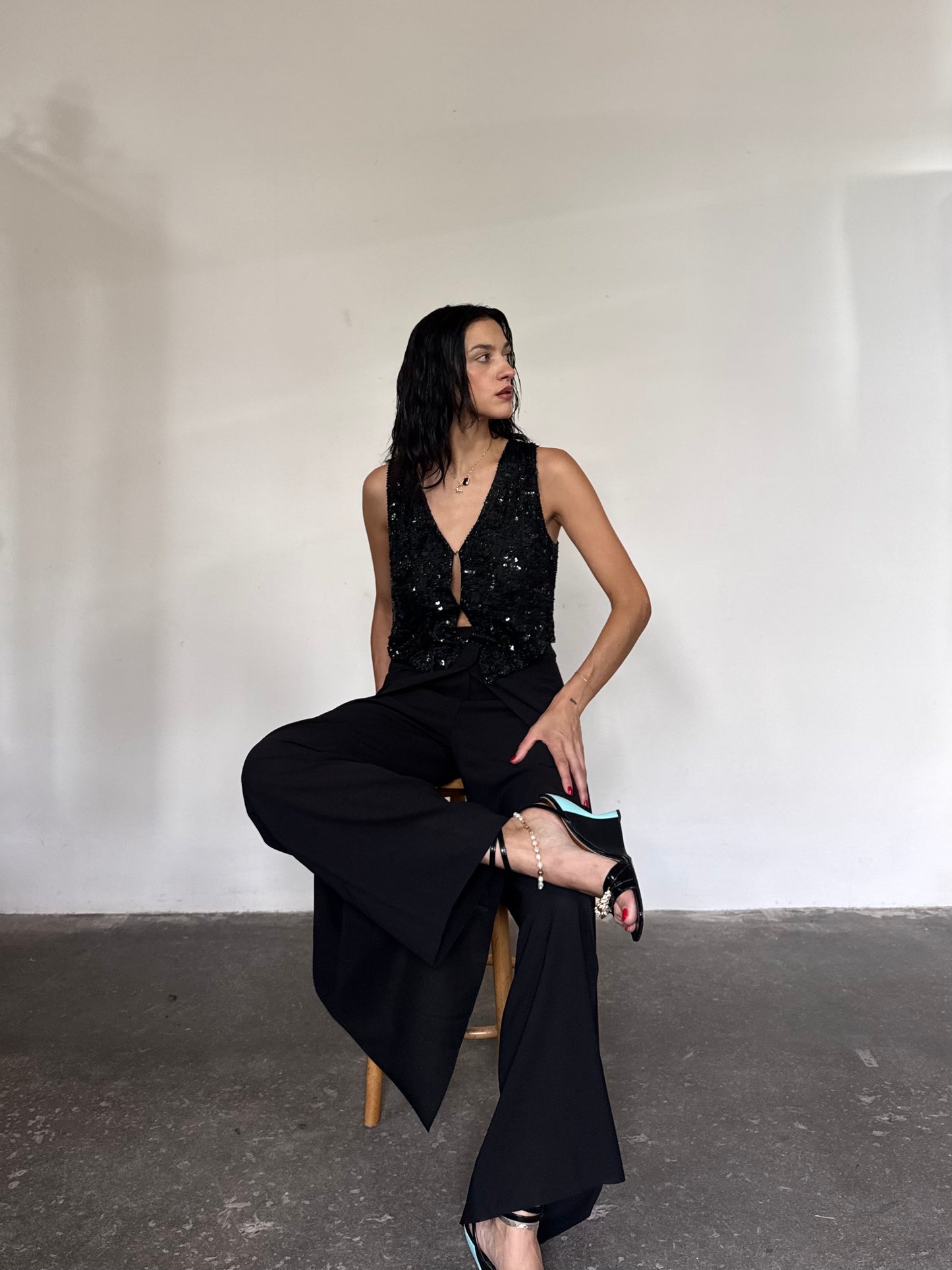 The black sequins vest