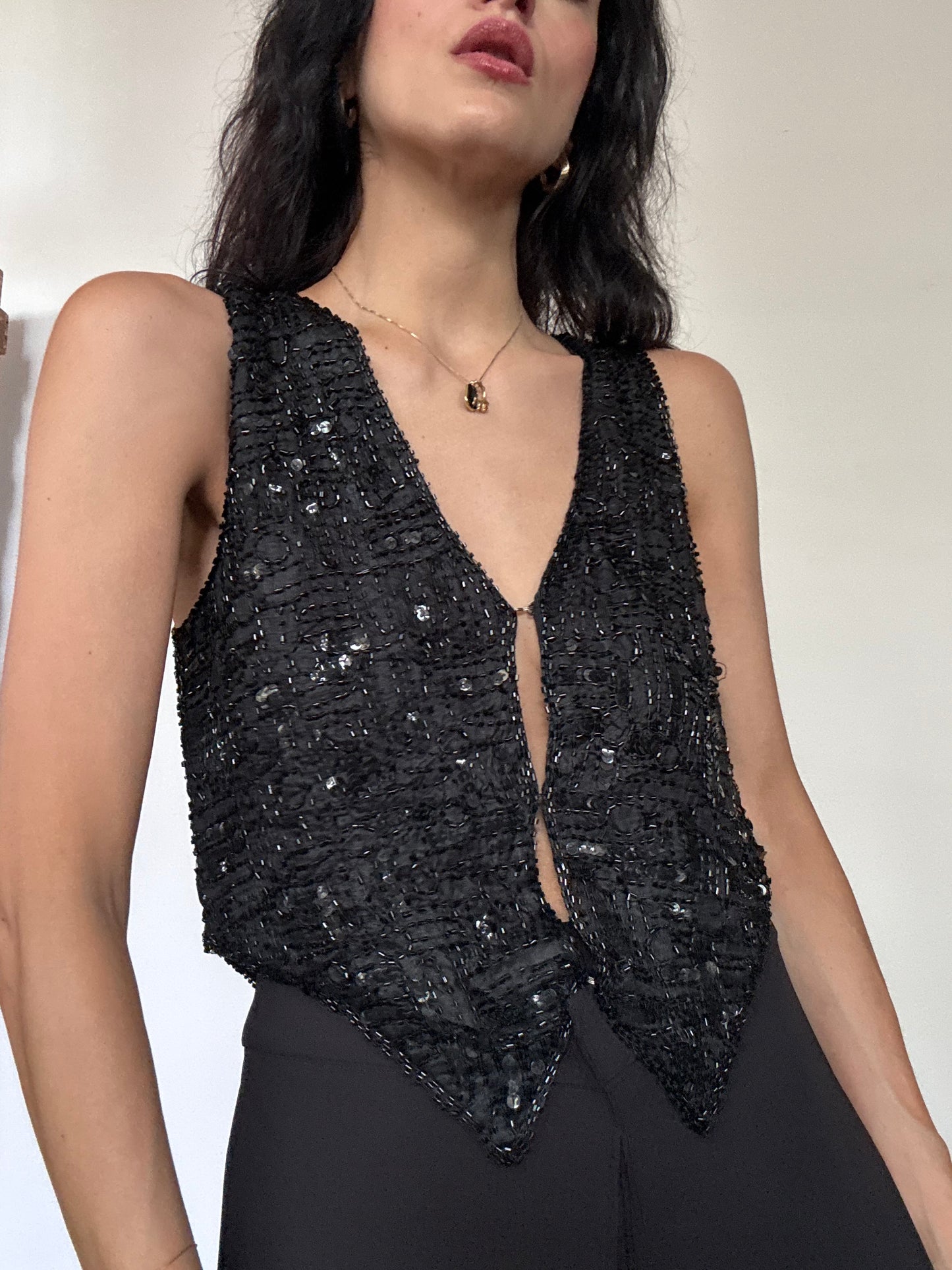 The black sequins vest