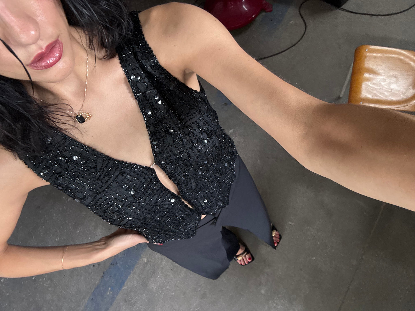 The black sequins vest