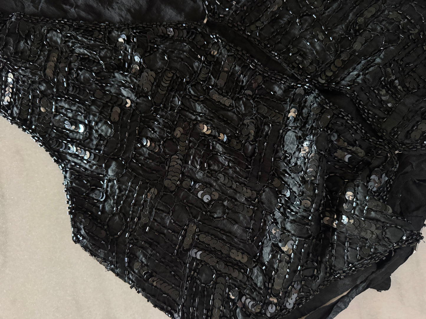 The black sequins vest