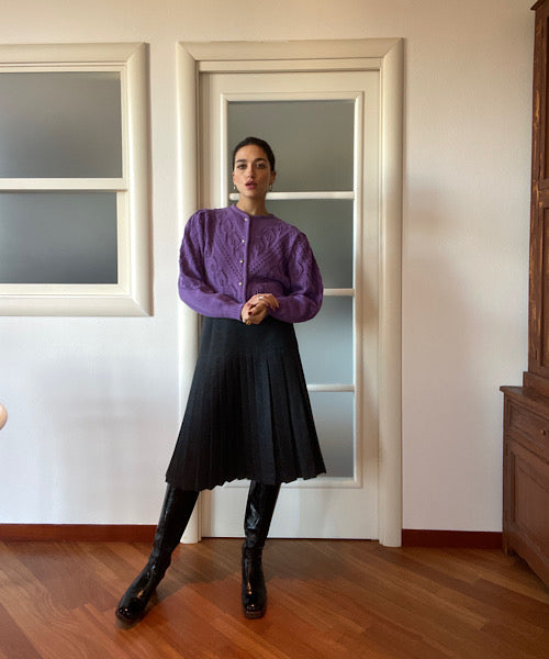 The dark grey pleated skirt